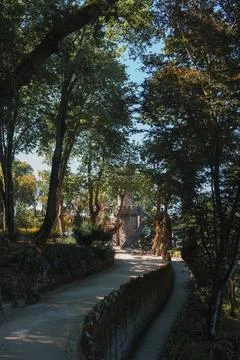 Serene Tree-Lined Pathway Leading to Historic Stone Structure in Sintra Stock Photos