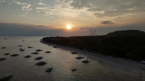 Serene Tropical Sunset with Boats on a Calm Beach Stock Footage 295790341