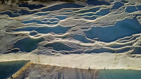 Serene turquoise pools cascade over white terraces Pamukkale, Turkey 스톡 동영상 332491373