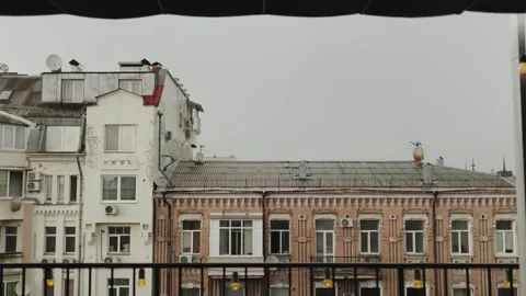 Serene view of city rooftops under cloudy sky, Old Town in overcast weather with Stock Footage 315888252