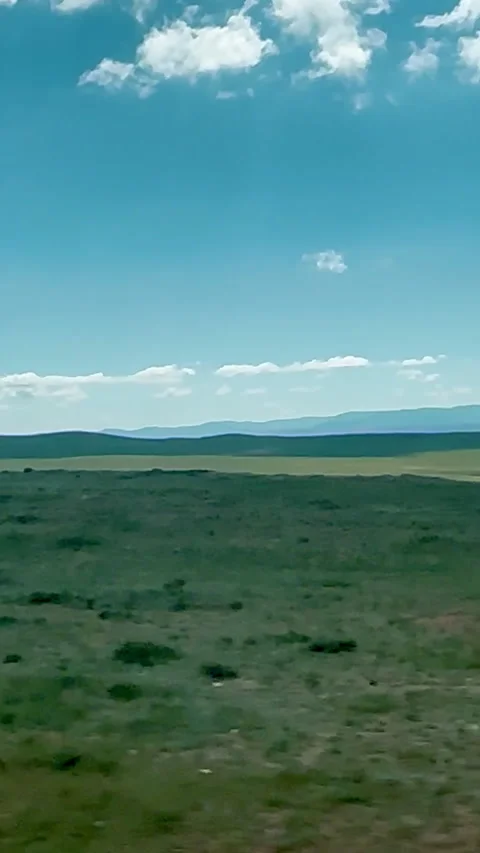 A serene view of an expansive open field in Mongolia Stock Footage 314069842