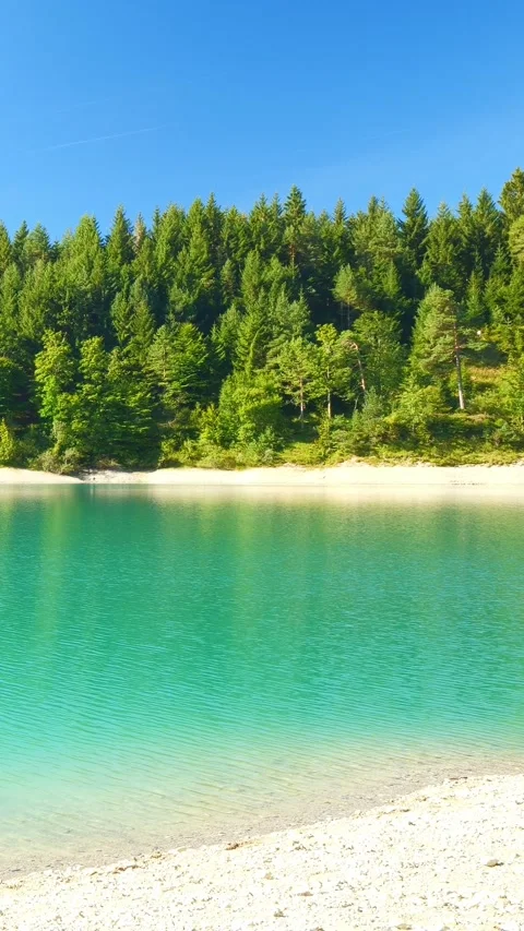 Serene view over alpine lake Urisee with turquoise water and scenic mountain Stock Footage 308302435