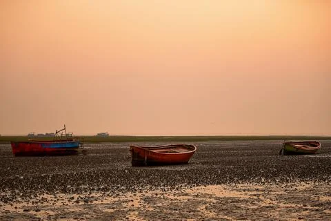 A serene view of the sunset at a beach in Chattogram, Bangladesh. Stock Photos