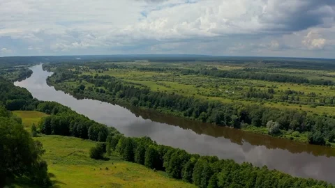 Serene Volga: Flowing Elegance Through Verdant Forest Stock Footage 280673328