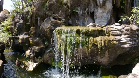 A serene waterfall at Wat Rong Khun  in Chiang Ra Stock Footage 309237853