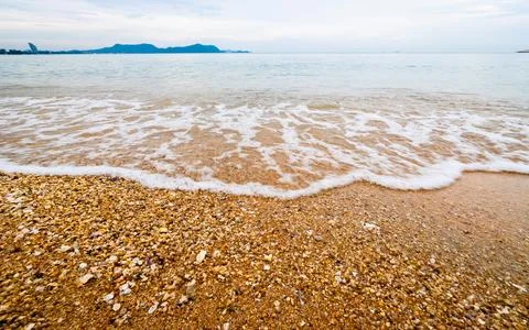 Serene waves lapping sandy shore tranquil beach nature scene coastal view p.. 写真素材