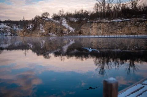 Serene Winter Lake with Reflective Cliffs Stock Photos