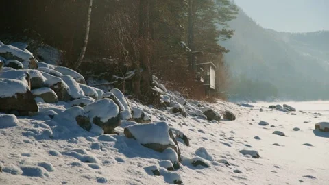 A Serene Winter Landscape featuring SnowCovered Rocks and Trees that evokes a Stock Footage 306917992