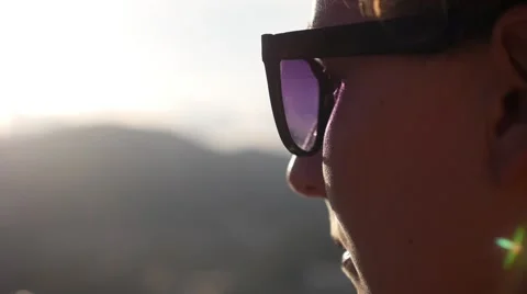 Serene Young Woman in Sunglasses Enjoying Sunset. Slow Motion. Stock Footage