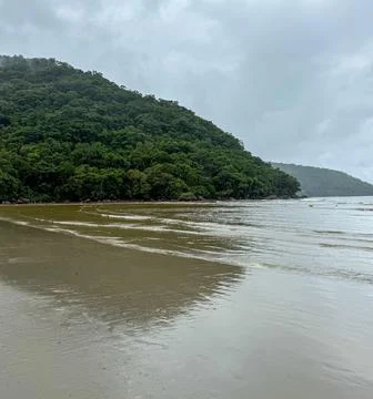 Serenity of Cloudy Beach Stock Photos