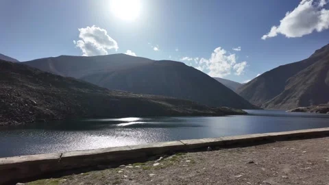 Serenity Found Scenic Roadside Drive Alongside Tranquil Lake with Calm Green Stock Footage 286338448