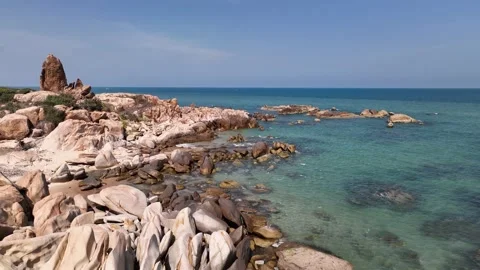 The Serenity of a Seashore with Rock Cliffs and Caves Stock Footage 238461497