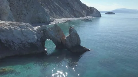Serenity of a secluded beach in Greece during a sunny summer day 库存影片 301735246