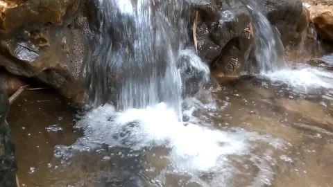 The Serenity of a Small Waterfall. Stock Footage 332156368