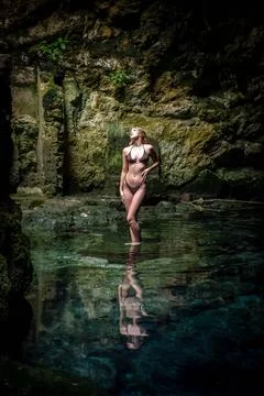 Serenity Unveiled: A Stunning Model's Bliss Amidst Cuzama's Enchanting Blue.. Stock Photos