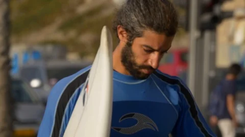 Serfist Walks With His Surfboard Stock Footage 90105513