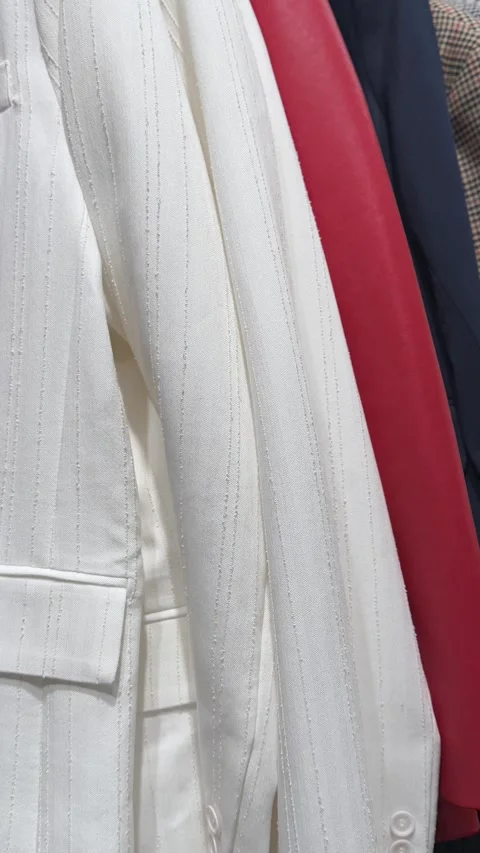 Series of clips showcasing a stop motion sequence of various clothes, creatin Stock Footage 303359853