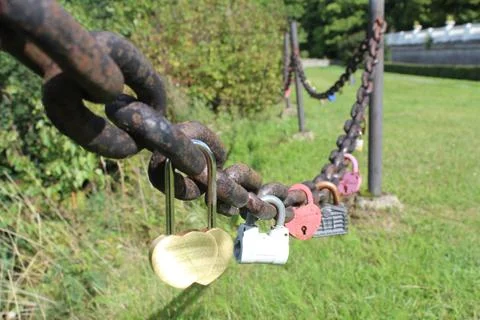 Series of colored padlocks in the chain Stock Photos