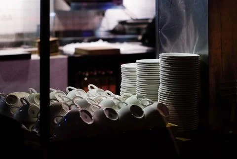 Series of cups and plates in the emty cafe Stock Photos