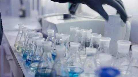 A series of flasks for chemical experiments. Close-up. Transparent glass Video stock 259371646