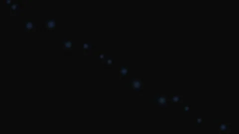 A series of glowing blue dots arranged in a diagonal line on black background Stock Footage 339617514