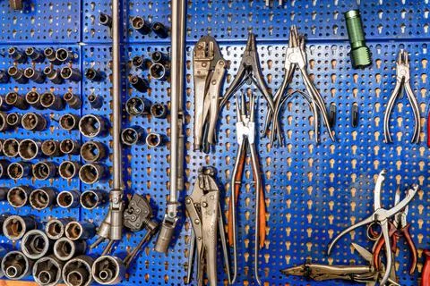A SERIES OF MECHANICAL TOOLS INCLUDING VARIOUS PLIERS, SOCKET WRENCHES, SCISS Stock Photos