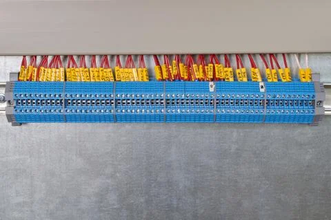 A series of pass-through terminals in the electrical Cabinet. Stock Photos