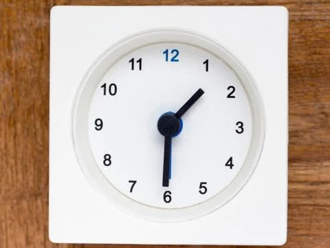 Series of the sequence of time on the simple white analog clock , 7/48 Stock Photos