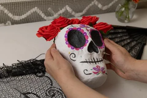 Series showcasing a handmade calavera in progress, from rough surface prep to Stock Photos
