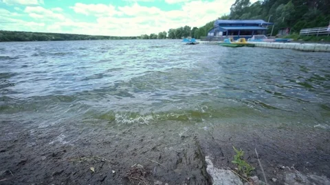 Series of waves by the river. Environmental pollution. Stock Footage 123712762