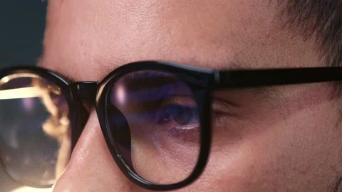 Serios young hacker looking or reading at pc, computer, laptop screen wearing Stock Footage 159473847