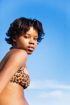 Serious african woman wearing bikini top Stock Photos