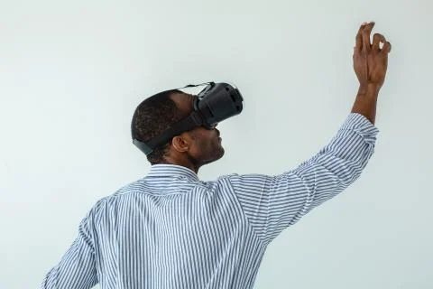 Serious afro american man using VR board Stock Photos