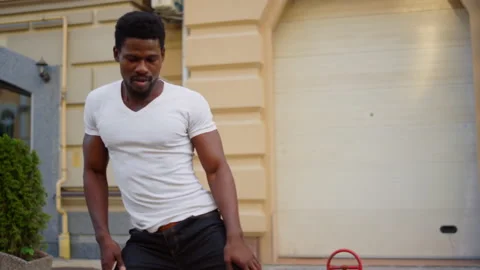 Serious afro man dancing bachata outdoors. Male dancer training latino on street Stock Footage 144661941
