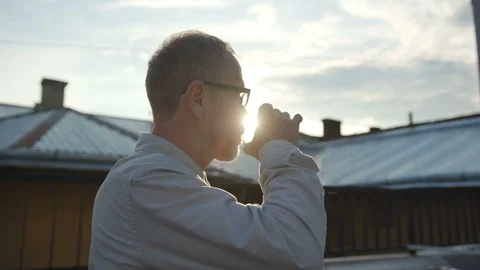 Serious and brooding Caucasian man with grey hair looking away. Portrait of Stock Footage 96311776