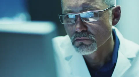 Serious and Focused Scientist Working on Computer Stock Footage