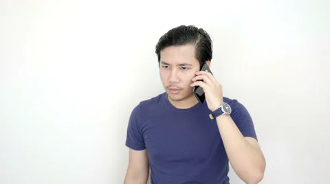 Serious Asian Man Calling With Smartphone On Studio White Background 4K Resol Stock Footage 59949031