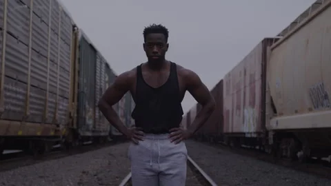 Serious Athletic Guy Stands In Train Yard Stock Footage 270327227