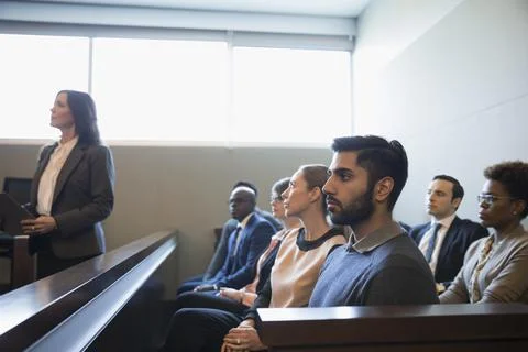 Serious, attentive jury listening in legal trial courtroom Stock Photos