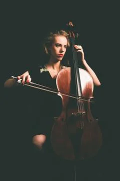 Serious attractive young classical cellist Foto stock