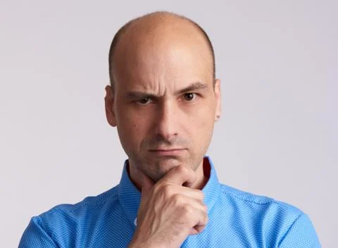 Serious bald man thinking Stock Photos