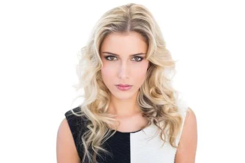 Serious blonde model looking at camera Stock Photos