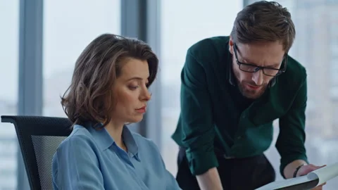 Serious boss asking manager about report data in company workspace closeup. Stock Footage 340528143