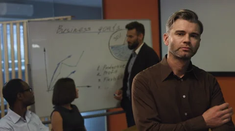 Serious boss looking in the camera Stock Footage 68338571