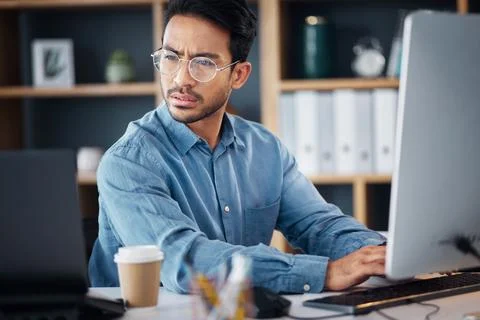Serious, business man working on computer, laptop and software development 写真素材