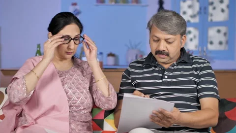 Serious business partners working with documents together at their home office Stock Footage 149477343