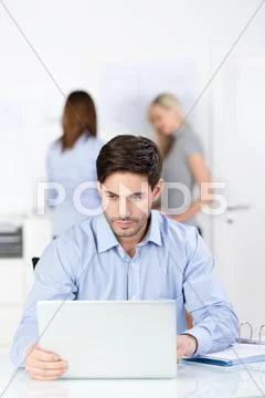 Serious businessman concentrating on his work Stock Photos