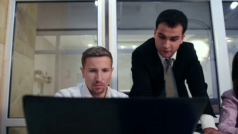 Serious businessman explaining plan to colleagues Stock Footage 70669801