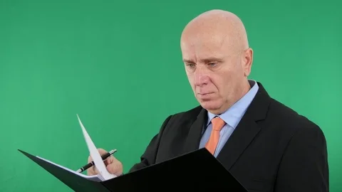 Serious Businessman Read and Write Data in One Technical Documents Folder. Stock Footage 71347169