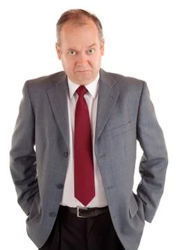 Serious businessman with a scowling expression Stock Photos